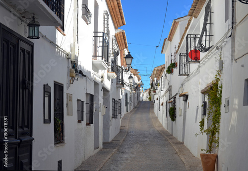The old center of Altea in Spain. The town of Altea is built on a hill with winding streets and whitewashed houses. © gertbunt