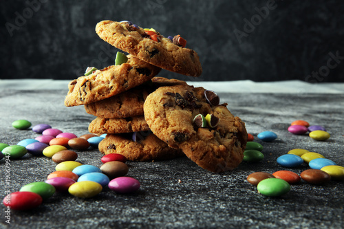 Chocolate cookies with colorful candies. Chocolate chip smarties cookies. photo