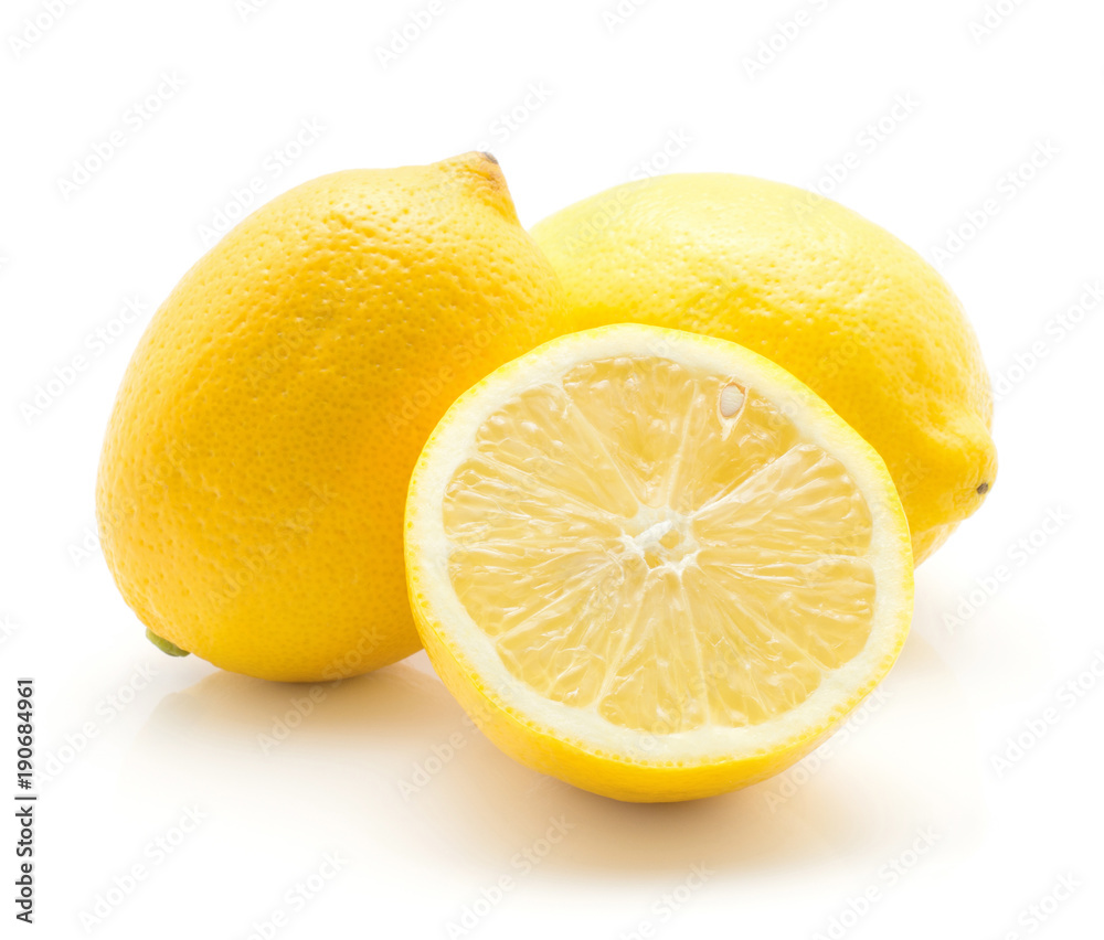Yellow lemons isolated on white background two whole ripe and one cross section half.