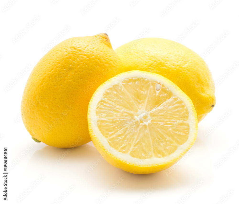 Yellow lemons isolated on white background two whole ripe and one cross section half. Yellow lemons isolated on white background two whole ripe and one cross section half.
