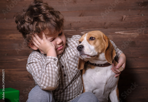 European boy and Beagle dog