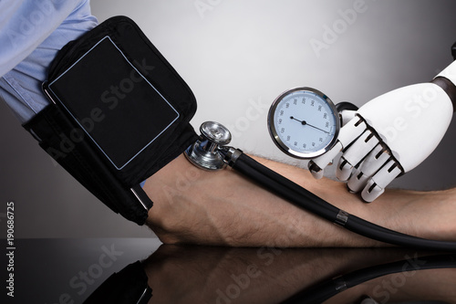 Robot Checking Person's Blood Pressure photo