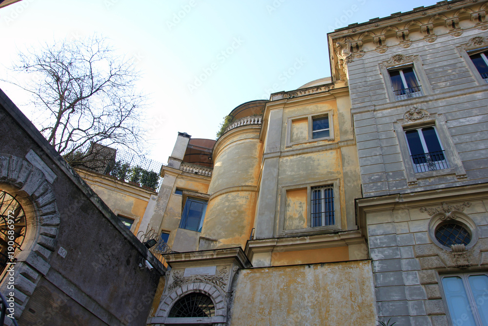 beautiful old medieval stone yellow buildings in trastevere in Rome
