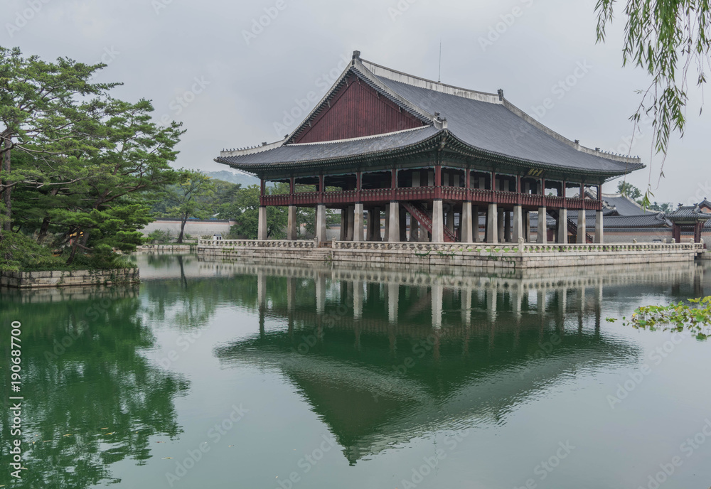 Small decorative palace, surrounded by water, and a reflection of the palace on the water, in Gyeongbokgung Palace, Seoul, South Korea Small decorative palace, surrounded by water, and a reflection of the palace on the water, in Gyeongbokgung Palace, Seoul, South Korea