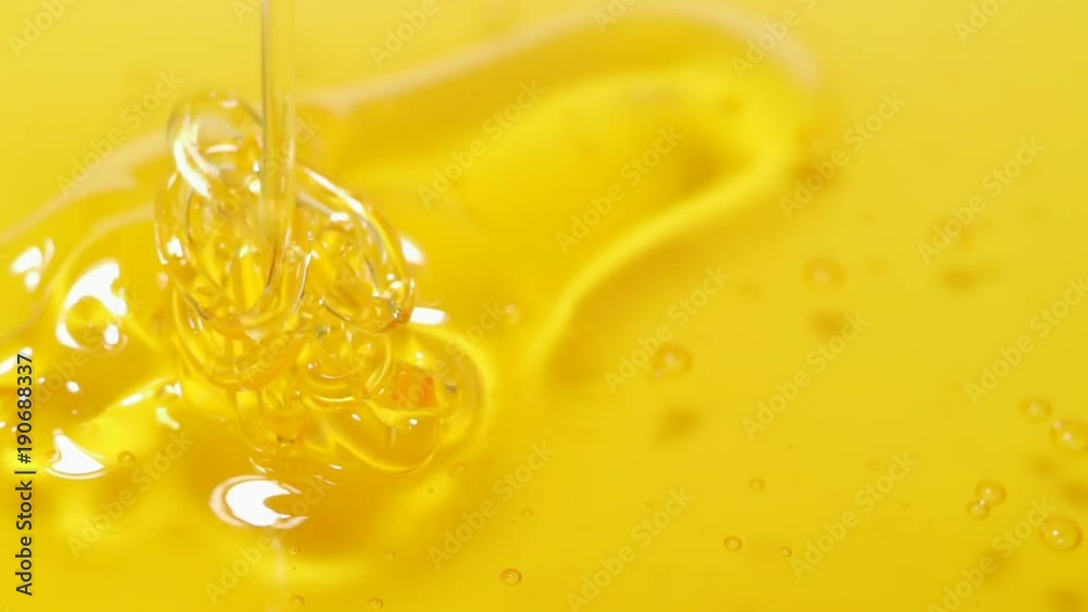 Honey on a ceramic white plate. Rotation Honey on a ceramic white plate. Rotation