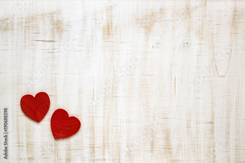 Red Valentine's Day hearts on wooden background