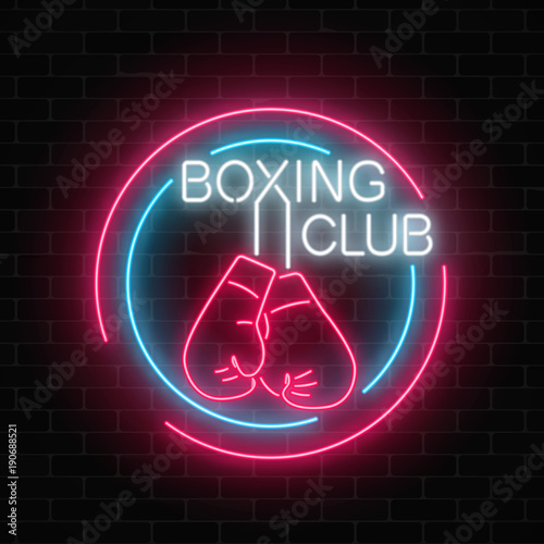 Glowing neon boxing club sign in circle frames on dark brick wall background. Fighting club neon signboard.