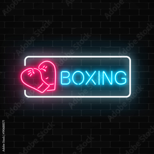Glowing neon boxing club sign in rectangle frame on dark brick wall background. Fighting club neon signboard.