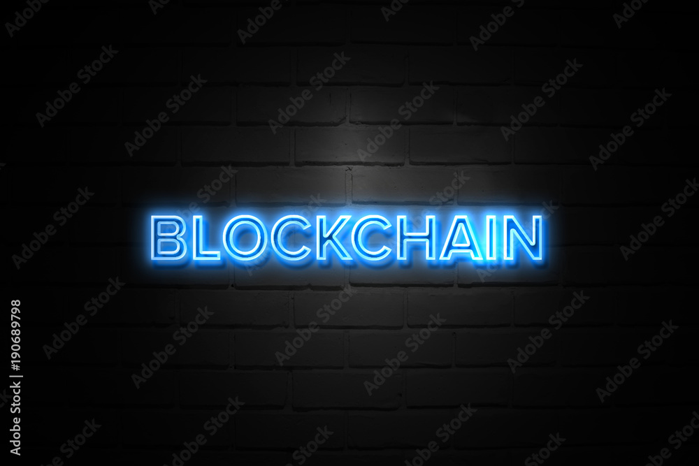 Blockchain neon Sign on brickwall Blockchain neon Sign on brickwall