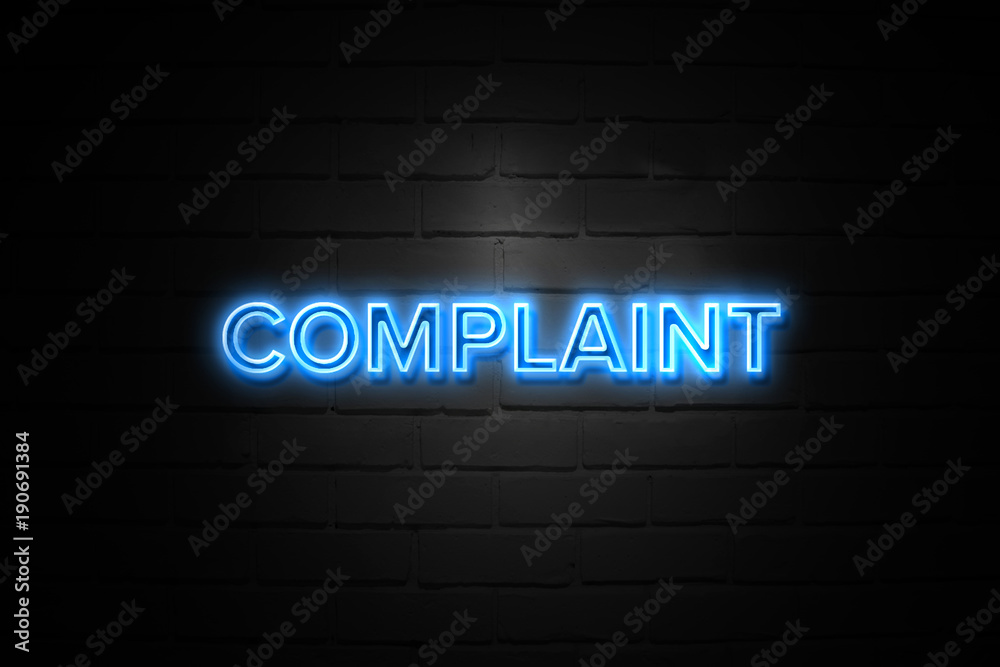Complaint neon Sign on brickwall Complaint neon Sign on brickwall