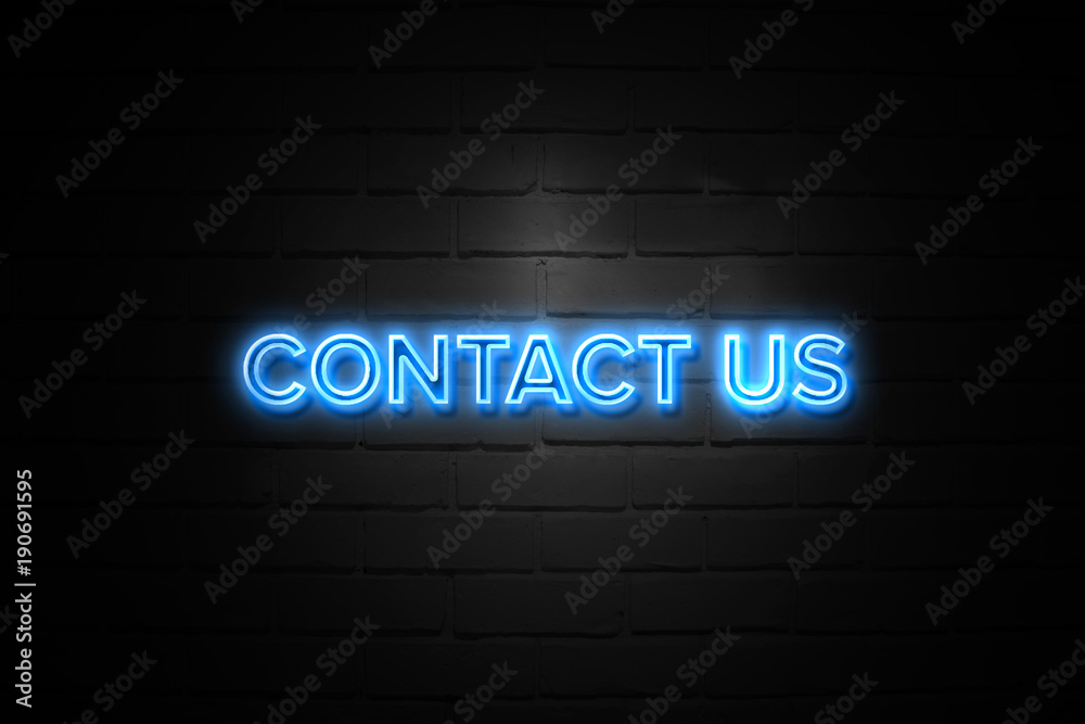 Contact Us neon Sign on brickwall Contact Us neon Sign on brickwall