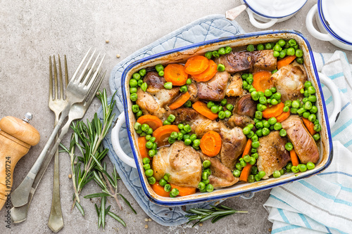Meat baked with carrot and green peas
