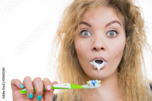 Woman brushing cleaning teeth