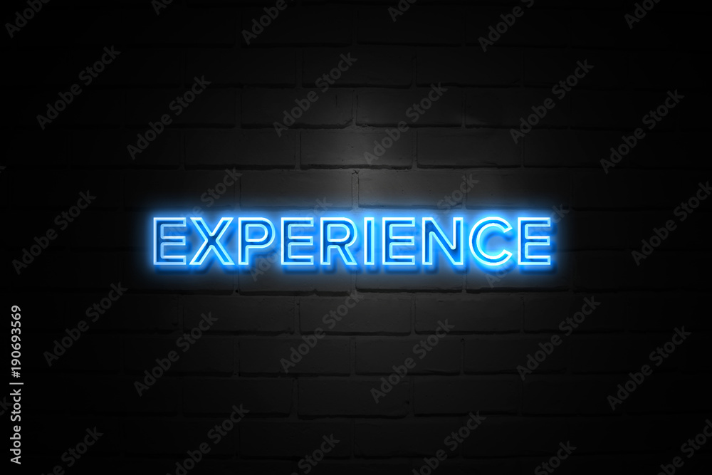 Obraz premium Experience neon Sign on brickwall