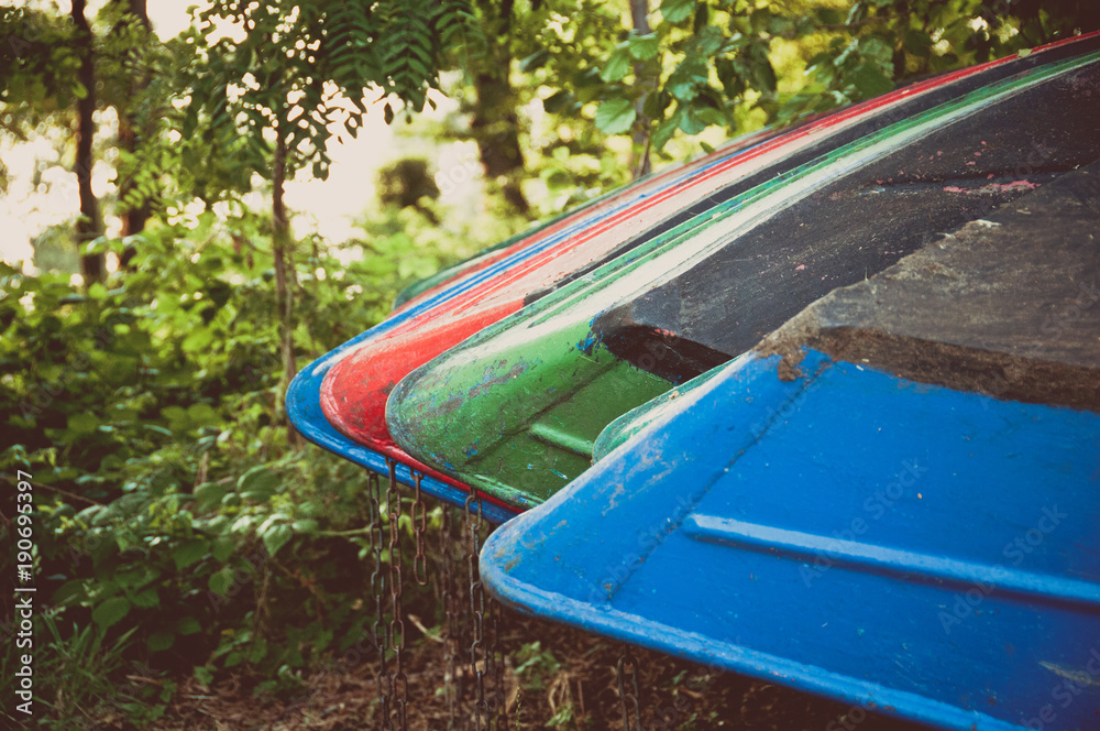 boats lying on the meadow for hobby rowing boats lying on the meadow for hobby rowing