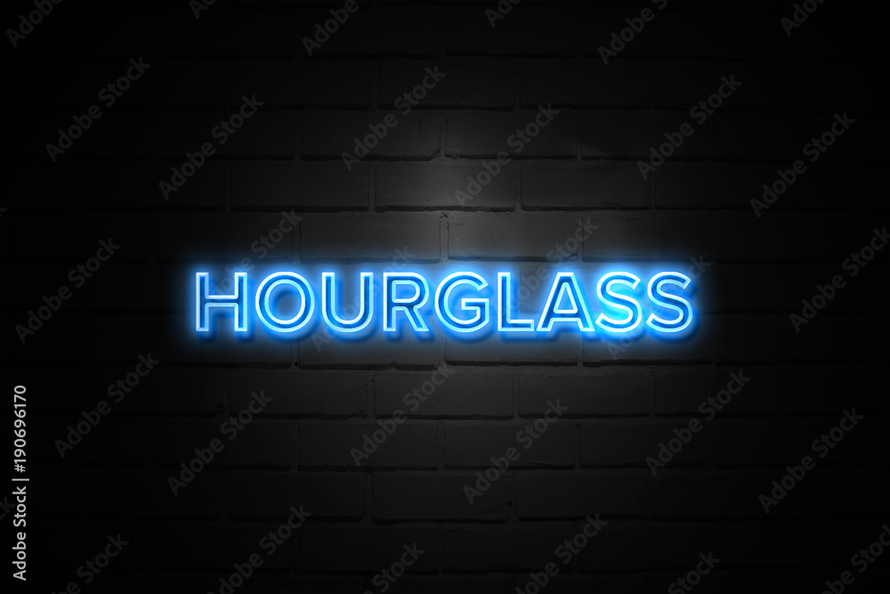 Hourglass neon Sign on brickwall Hourglass neon Sign on brickwall