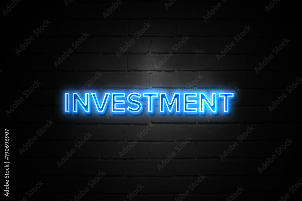 Investment neon Sign on brickwall Investment neon Sign on brickwall