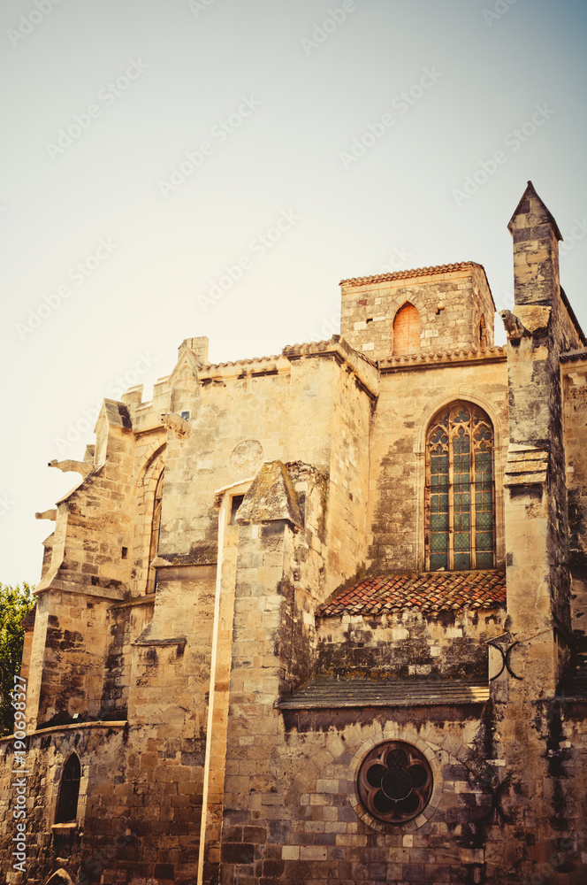 Ancient architecture in Narbonne, France in warm sunlight