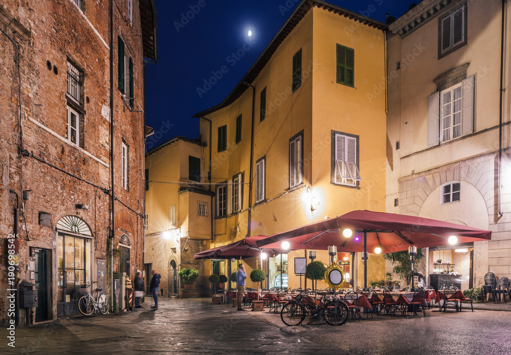 Cafe in Piazza degli Scalpellini at night, Lucca, Italy