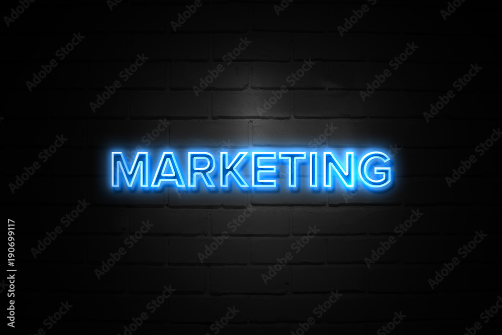 Marketing neon Sign on brickwall Marketing neon Sign on brickwall