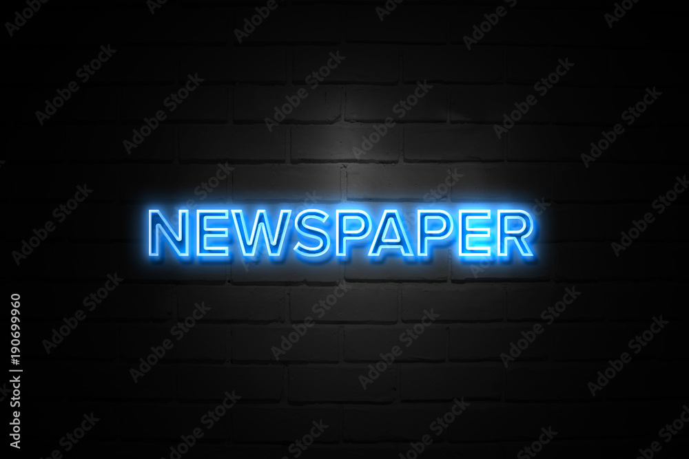 Newspaper neon Sign on brickwall Newspaper neon Sign on brickwall