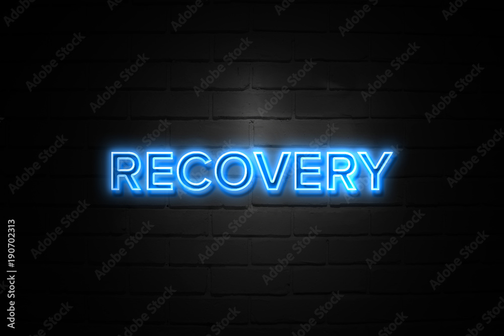 Recovery neon Sign on brickwall Recovery neon Sign on brickwall