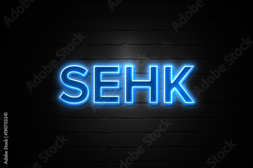 Sehk neon Sign on brickwall photo