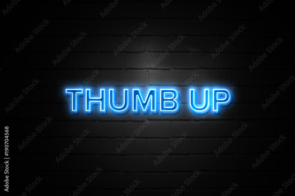 Thumb Up neon Sign on brickwall Thumb Up neon Sign on brickwall