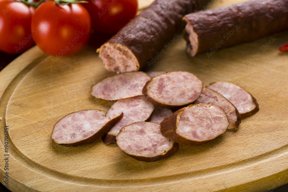 Sandwiches with homemade smoked sausage located on a board - food for consolation - tasty and healthy Sandwiches with homemade smoked sausage located on a board - food for consolation - tasty and healthy