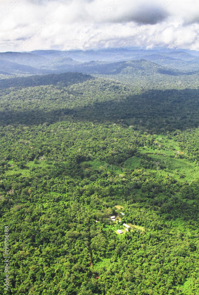 An aerial view of the Cockscomb Basin in central Belize, and some very remote houses nestled in the jungle.