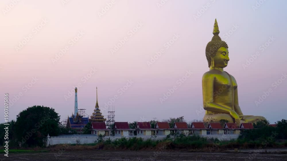 Big Buddha in Thailand with twilight sky at sunrise