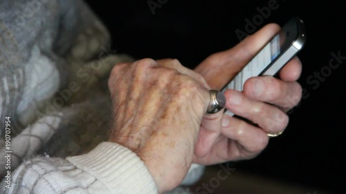 Elderly man on smart phone photo