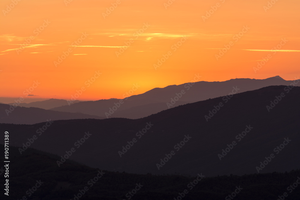 layers of mountains at sunset