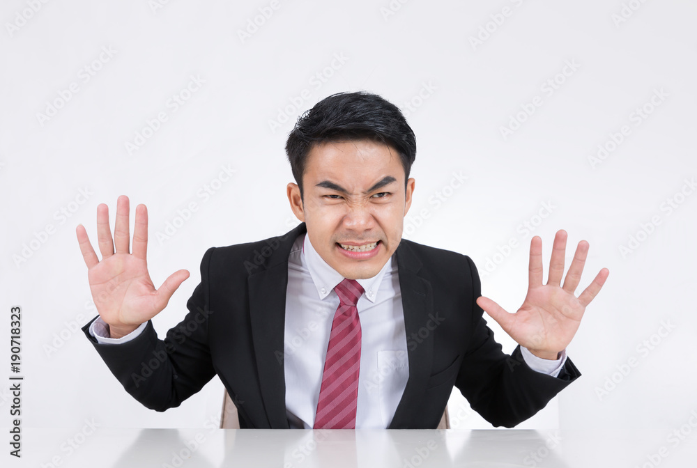 Portrait of a angry businessman at office isolated on white background. Portrait of a angry businessman at office isolated on white background.