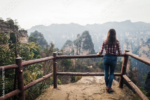Traveler standing and watching on the wonderful view of mountains at China