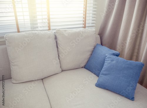  Sofa and pillow in living room interior with sun flare.