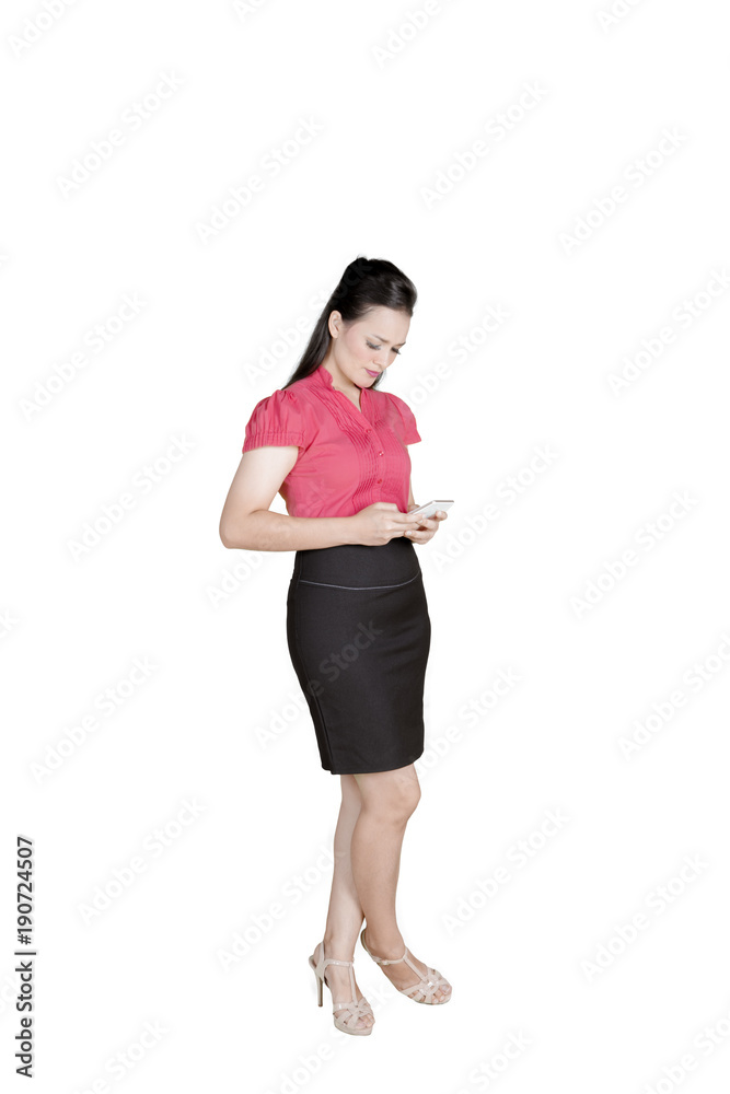 Beautiful entrepreneur using a smartphone on studio Beautiful entrepreneur using a smartphone on studio