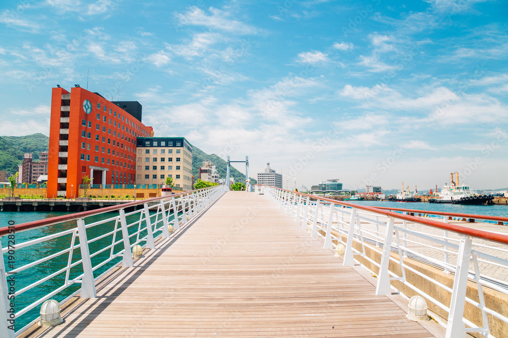 Blue wing moji bridge and sea in Mojiko retro town, Japan Blue wing moji bridge and sea in Mojiko retro town, Japan
