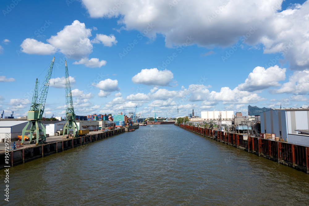 The seaport of Hamburg on a sunny summer day. Blue sky with beautiful clouds