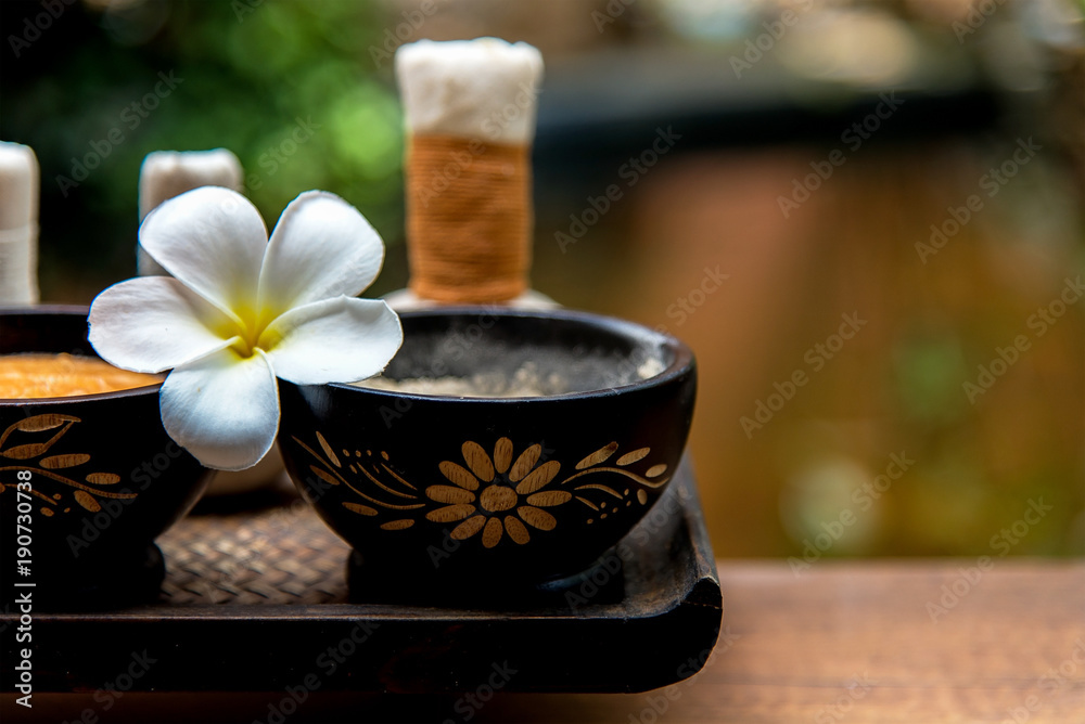 Spa Thai setting for aroma therapy and sugar and salt massage with flower on the bed, relax and healthy care. Healthy Concept Spa Thai setting for aroma therapy and sugar and salt massage with flower on the bed, relax and healthy care. Healthy Concept