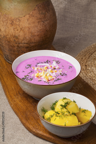 Traditional lithuanian cold beet pink soup, prepared of cucumber, beetrot, eggs and sour cream,  called saltibarsciai 
