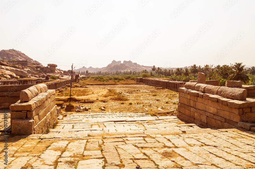 View of ancient ruins of Krichna Bazaar in Hampi, India.