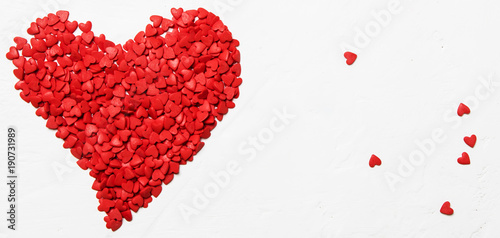 Red heart from sweet sugar hearts, Valentine's Day card, light background, top view