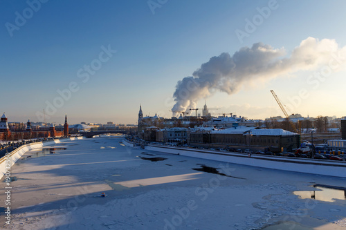 Views of Moskva river from the Bol'shoy Kamennyy Bridge at sunny winter morning. Moscow in winter