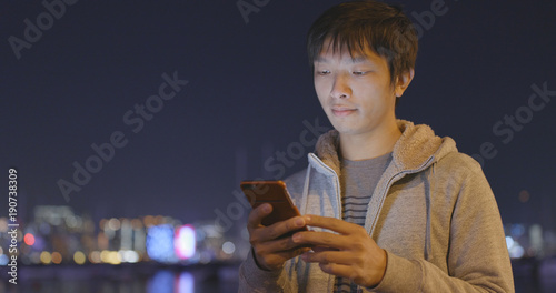 Canvas Print Man using mobile phone at night