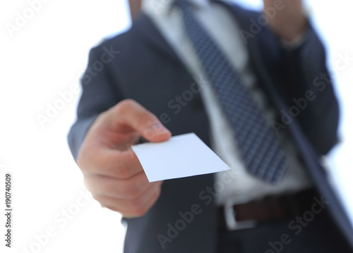Business man giving business card on bright background