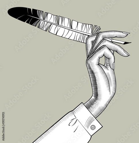 Woman's hands holding a feather pen