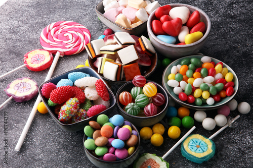 candies with jelly and sugar. colorful array of different childs sweets and treats photo