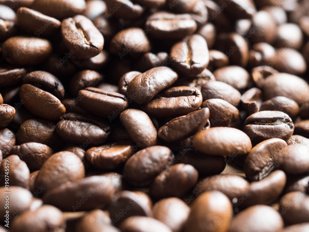 Black and brown cofee seed full frame for background Black and brown cofee seed full frame for background