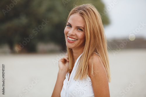 Close up portrait of beautiful young woman with wonderful smile